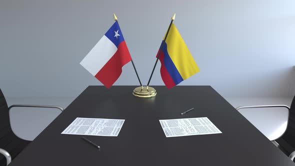 Flags of Chile and Colombia and Papers