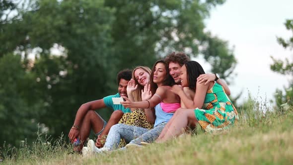 Group of friends having a great time taking selfies