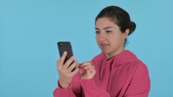 Indian Girl Using Smartphone Blue Background