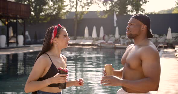 Black Man Flirting with an Attractive Woman at Swimming Pool