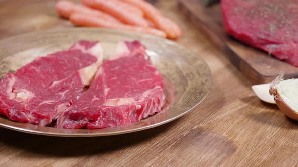 Raw Beef Steak on a Vintage Bronze Plate