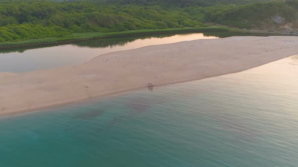 Aerial Drone View of Wide Sand Stripe Between Veleka River and Black Sea. Calm Water Surface