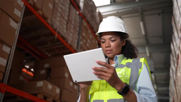 Woman Manager Doing Stocktaking in Storehouse