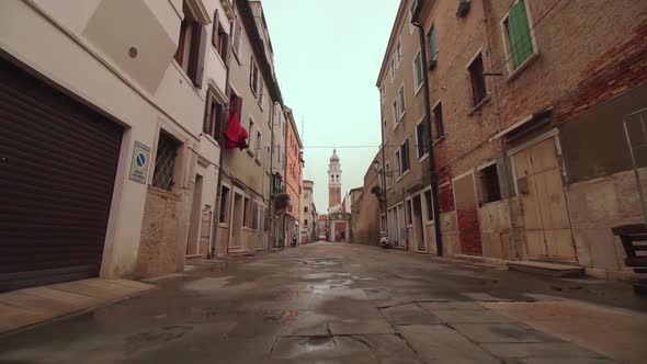 Pedestrian street and houses in the city of Chioggia, in Italy