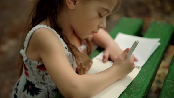 Cute Small Kid Girl Enjoying Creative Art. Adorable Preschool Child Learning Drawing Picture.