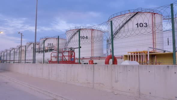 Oil Storage Tanks at Sunset Time