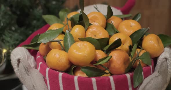 Tangerines in Red and White Christmas Busket