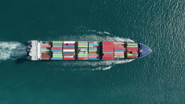 Multicolored Container Vessel Transports the Goods As Seen From the Top