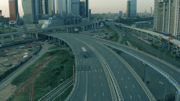 Semitrailer Truck Driving on Empty Highway in Urban Environment