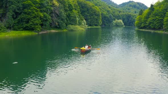 Young Couple in a Boat on the Biogradsko Lake in Montenegro