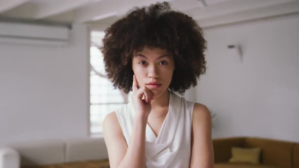 Front view of mixed race woman in creative office