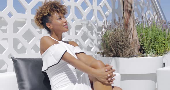 Elegant Model Relaxing on Terrace