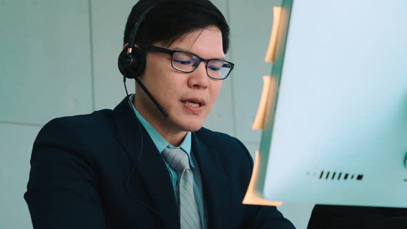 Business People Wearing Headset Working in Office