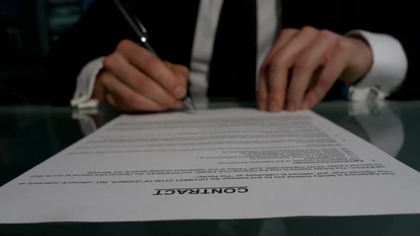 Business People Signing the Contract To Conclude a Deal