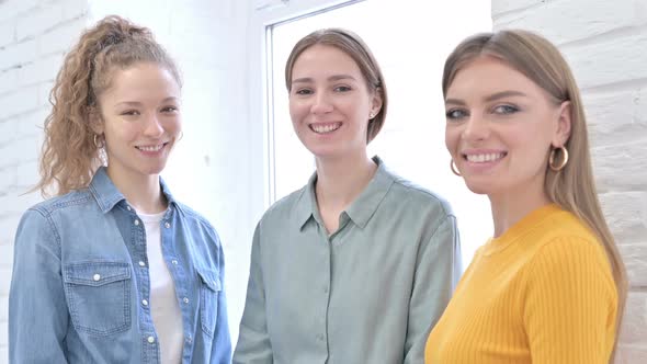 Cheerful Creative Female Designers Smiling at the Camera