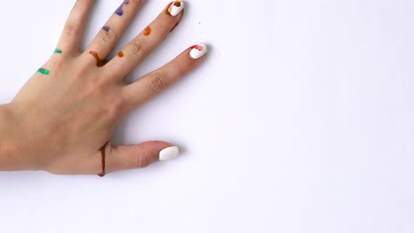 Creative Concept  Man and Woman Make Prints of Their Painted Hands on a White Background