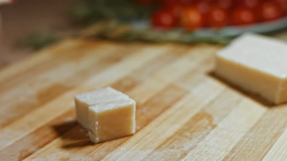 Gnocci with Tomato Sauce Being Sprinkled with Parmesan