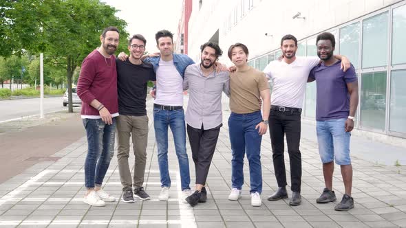 Happy group of best friends standing in a row