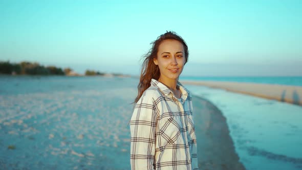 Outdoors Portrait of Happy Attractive Mixed Race Woman Enjoying Sunset on Wild Sea Sand Beach with