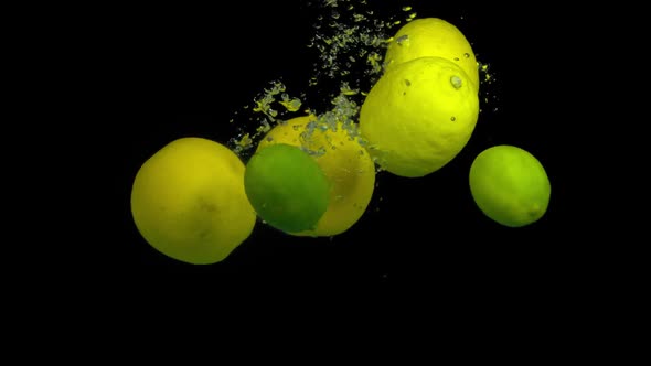 Citrus Fruit in Splash Water on a Black Background