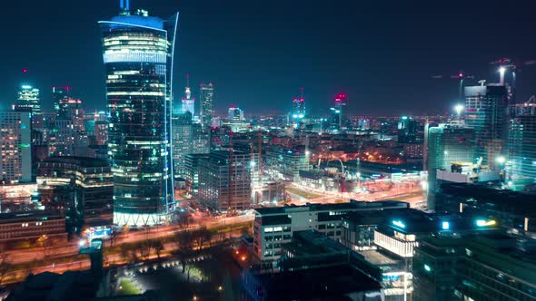 Aerial Hyperlapse of Warsaw Business Center at Night: Skyscrapers and Palace of Science and Culture