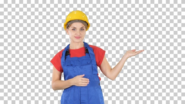 Young builder worker woman presenting showing product with