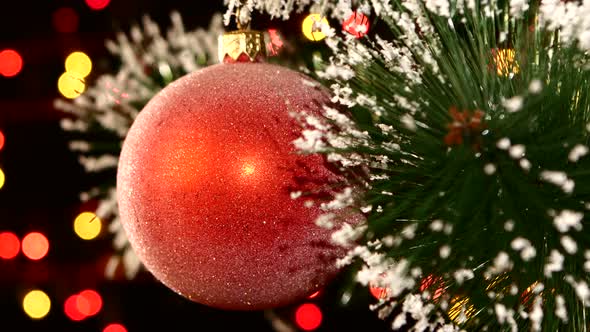 Unusual Decoration - a Round Shiny Red Toy on Christmas Tree, Bokeh, Light, Black, Garland, Cam