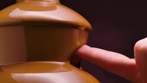 Melted Milk Chocolate Flows in a Chocolate Fountain
