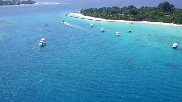 Aerial panorama of island beach break by ocean with sand background