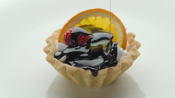 Fruit Tart with Strawberry Orange Kiwi and Chocolate Sauce