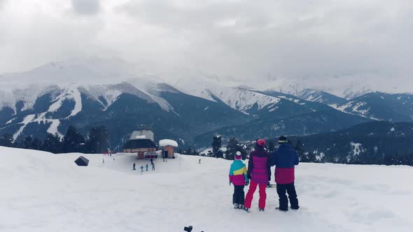 Happy Family Enjoying Winter Vacations in Mountains. Family Ski Vacation