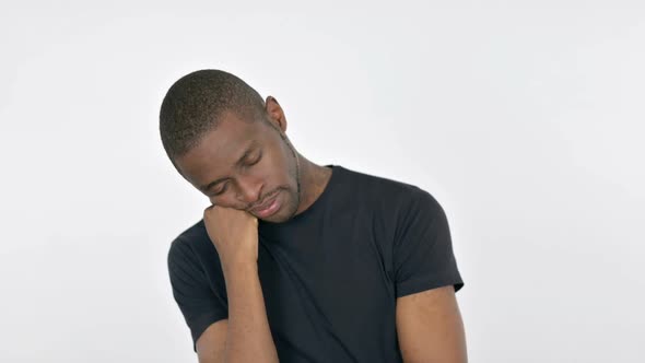 Sleeping Young African Man on White Background