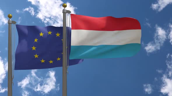 European Union Flag Vs Luxembourg Flag On Flagpole