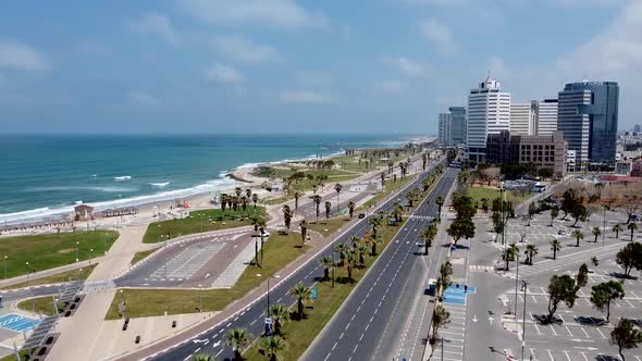 Aerial, static drone shot of an empty street park and beach in central Tel-Aviv. Covid-19 quarantine