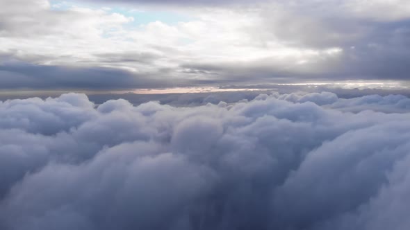 Amazing Aerial Shot: Drone Flying Over Fluffy Blue and White Clouds.