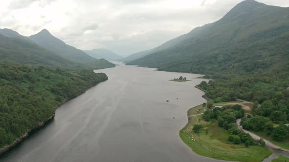 Dolly back drone shot over Scottish Loch Leven