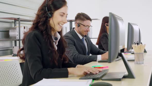 Business People Wearing Headset Working in Office