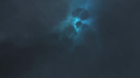 Epic thunderstorm Clouds at Night with lightning background.