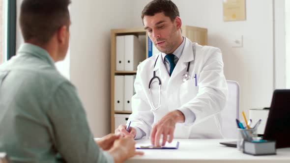 Doctor Giving Prescription for Patient at Clinic 37