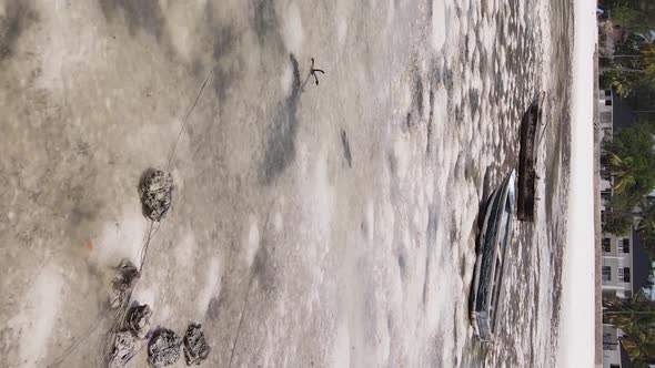 Vertical Video of Low Tide in the Ocean Near the Coast of Zanzibar Tanzania Aerial View