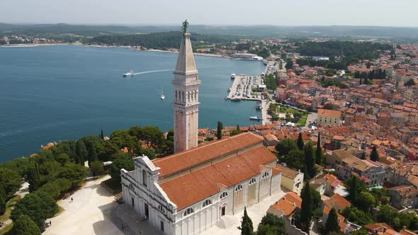 Aerial rotating shot over St. Euphemia church in Rovinj, Istria, Croatia with the view of the town i