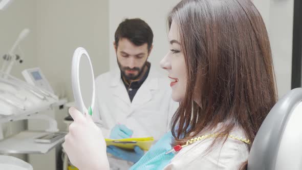 Cheerful Woman Smiling to the Camera After Dental Checkup