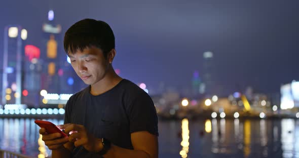 Man use of smart phone at night