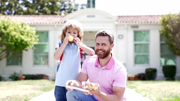 Happy Family of Child Boy and Daddy Having Food at School Slow Motion Family