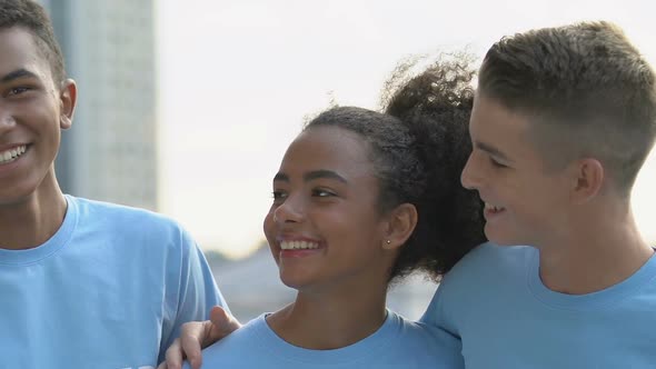 Merry Multi-Ethnic Group of Camp Friends Hugging and Laughing on Camera, Relax