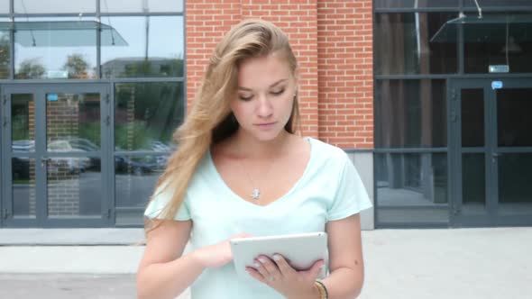 Walking Girl Using Tablet