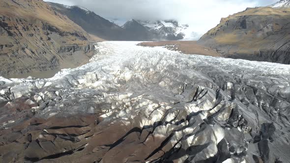 Slow Cinematic Aerial Shot Flying Towards the Base of a Glacier.