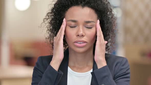 Exhausted African Businesswoman with Headache Portrait