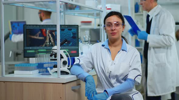 Tired Laboratory Doctor Looking at Camera Smiling