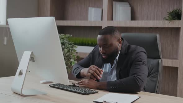 African American Tired Deprived Businessman Feeling Lack of Sleep Having Nap at Workplace Black